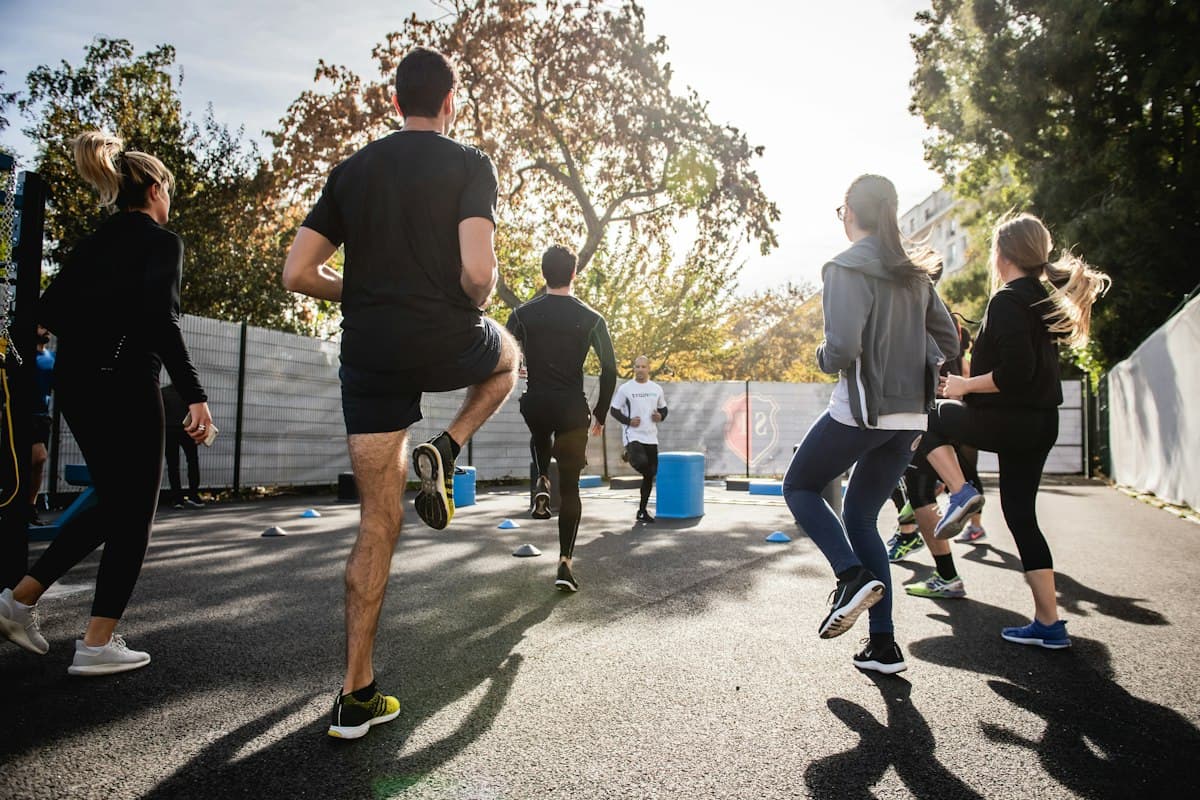 Group running drills at an outdoor training session