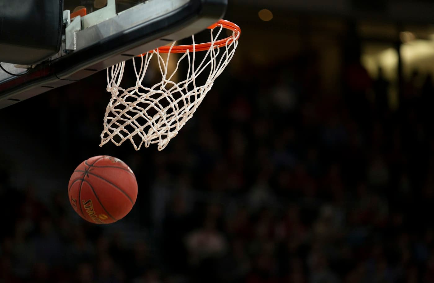 Basketball dropping through the hoop